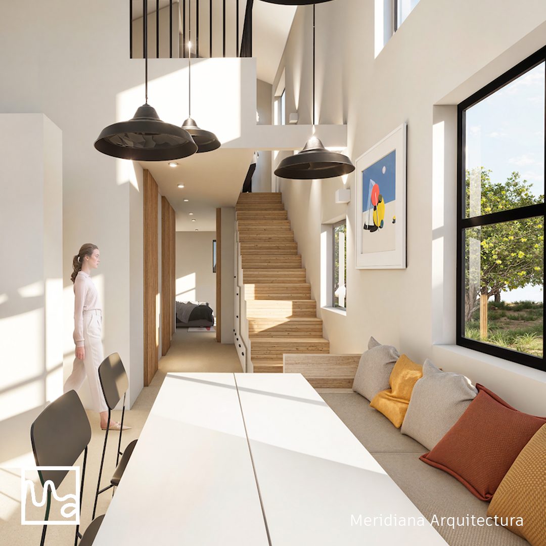 Interior remodelado con escalera de madera y marcos de ventana amarillos