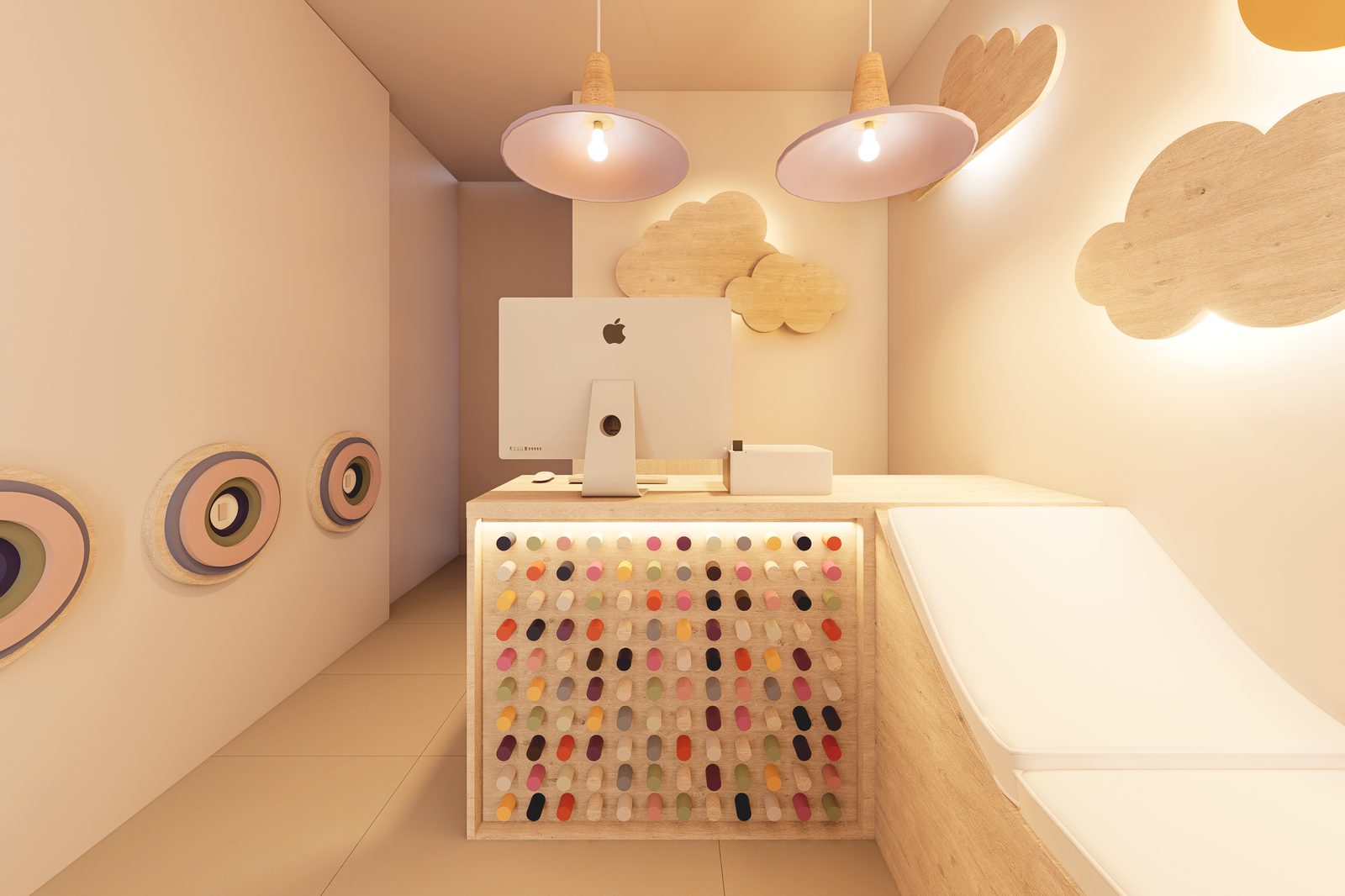 Sala de espera odontopediátrica con arcoíris retroiluminado y juegos de madera